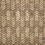 Handwoven rug detail in a herringbone design in tan and beige