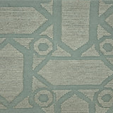 Handmade rug with geometric pattern in light turquoise