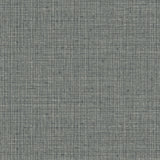 Detail of wallpaper in a textured tweed pattern in shades of gray-green.