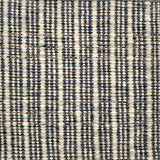 Handwoven rug detail in a stripe design in black and white