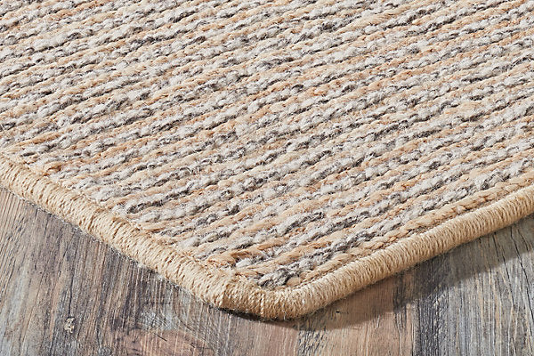 Textured woven mat on a wooden floor