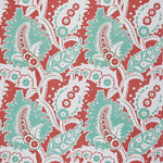 Detail of fabric in a botanical paisley print in shades of white, turquoise and green on a red field.