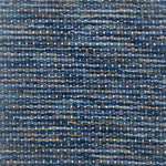 Textured handwoven carpet with a mix of blue colors. 