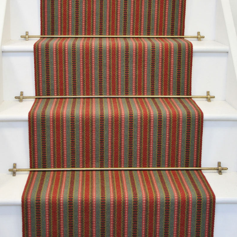 Striped flatweave runner in red grey and pink on white staircase