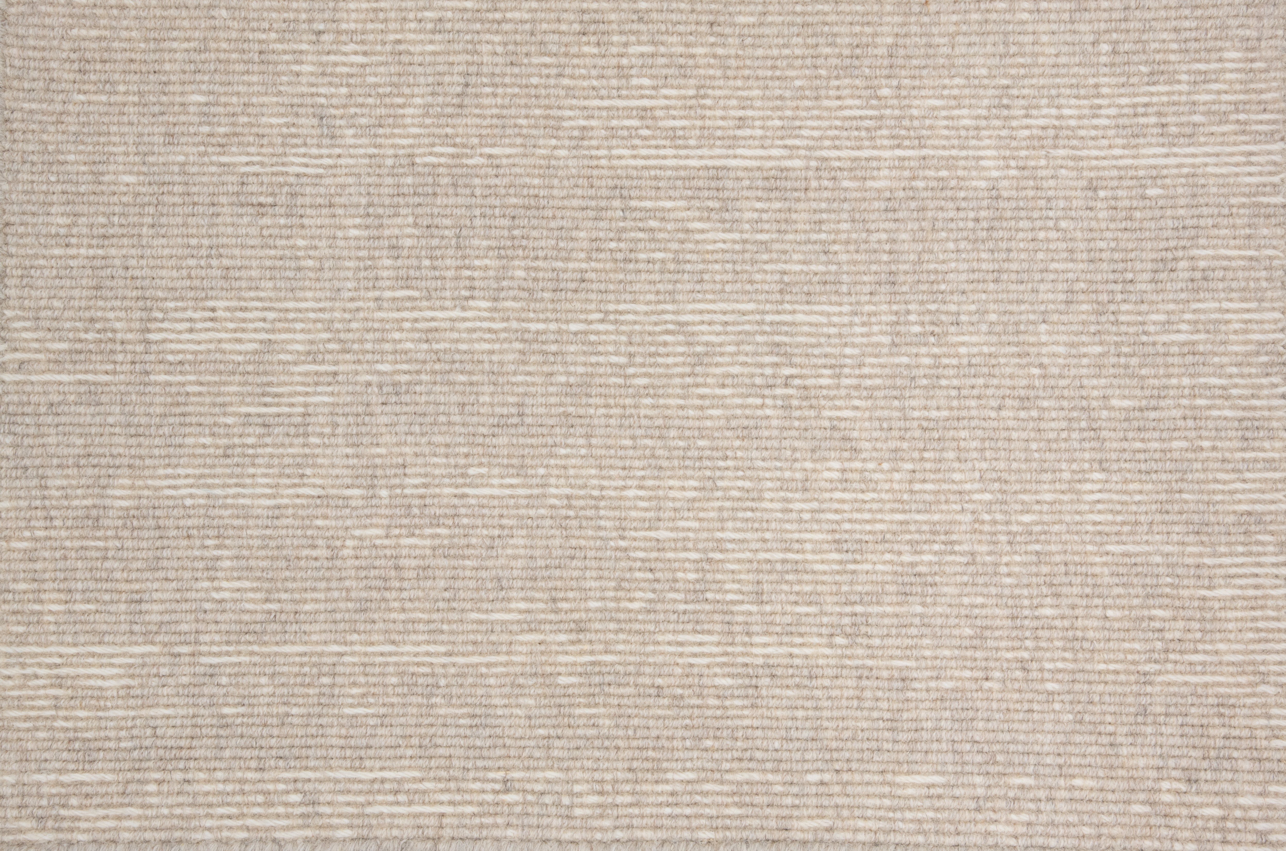 Broadloom carpet with ribbed stripe in ivory.