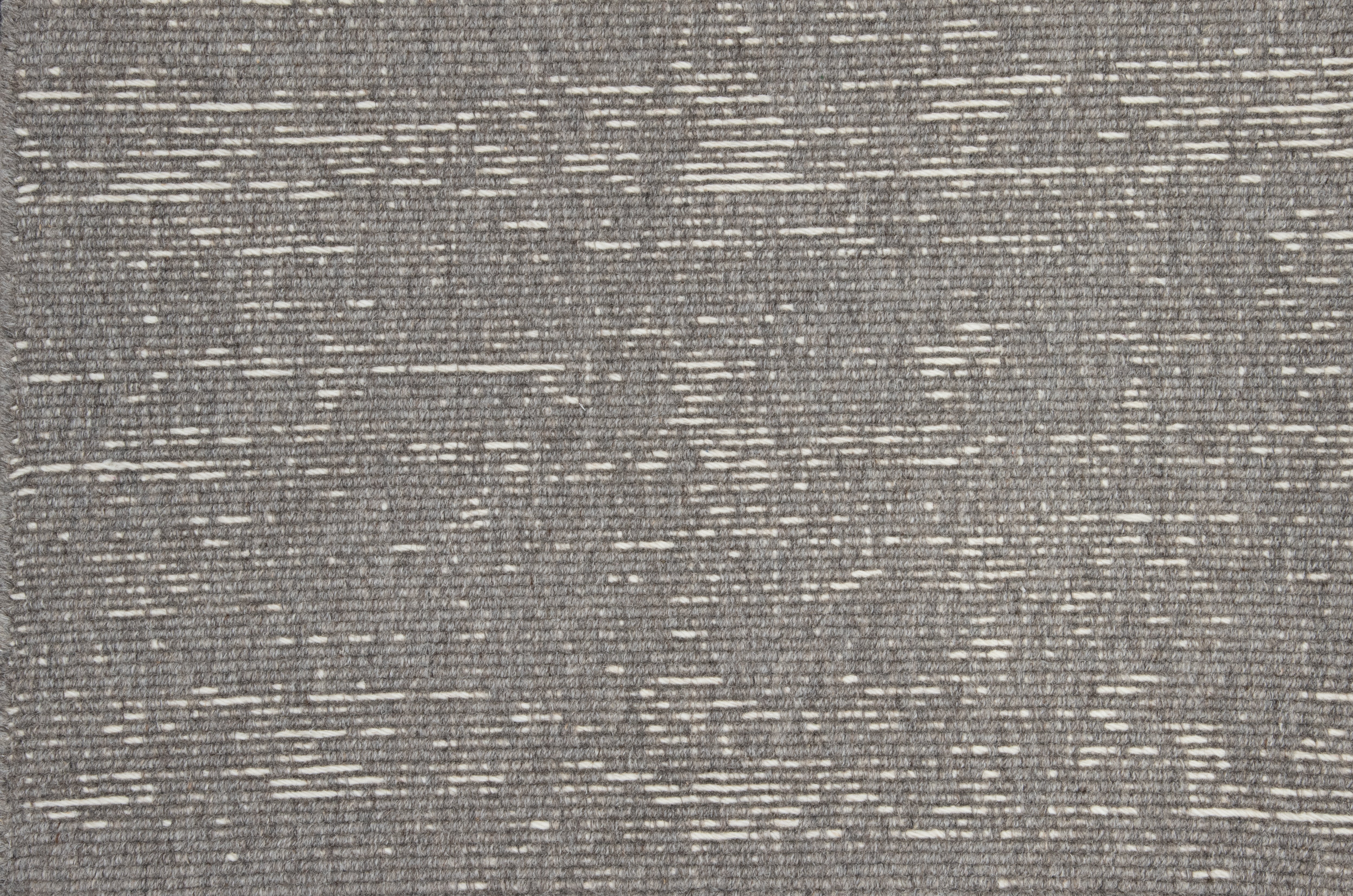 Broadloom carpet with ribbed stripe in grey.