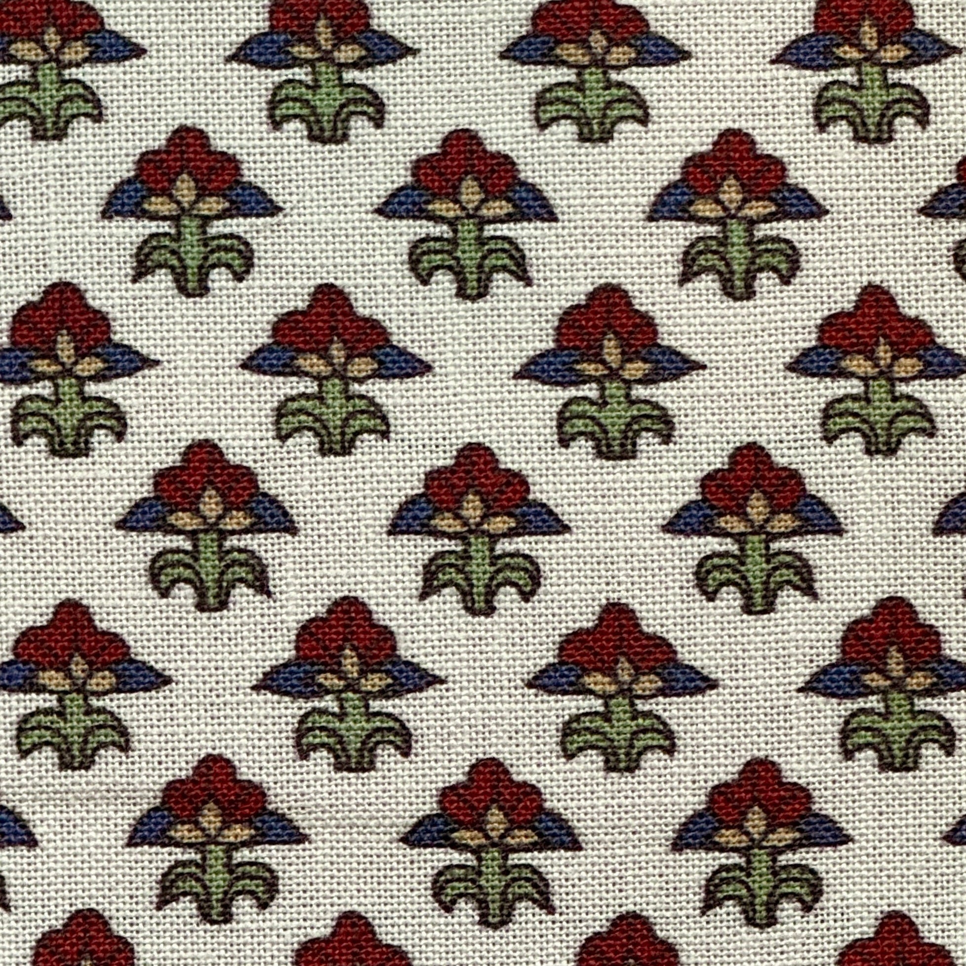 Pattern of stylized flowers with red centers and green leaves on a white background