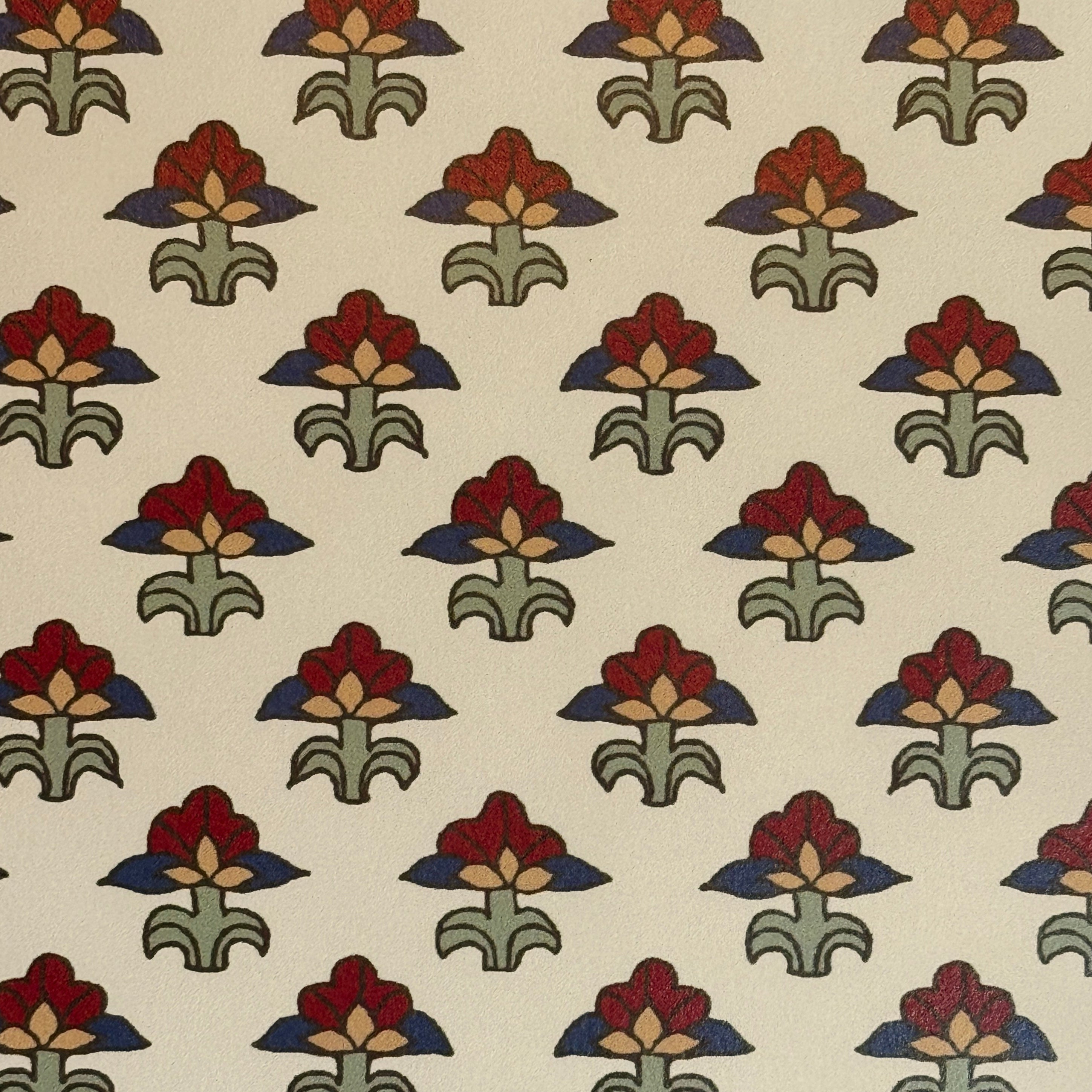 Patterned fabric with red, green, and blue floral design on a beige background