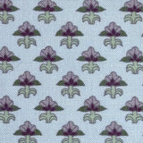 Pattern of purple and green floral designs on a light blue background