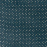 printed linen fabric in a clustered dot pattern in cream on an indigo field.