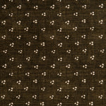 Detail of a linen fabric in a clustered dot pattern in cream on a dark brown field.