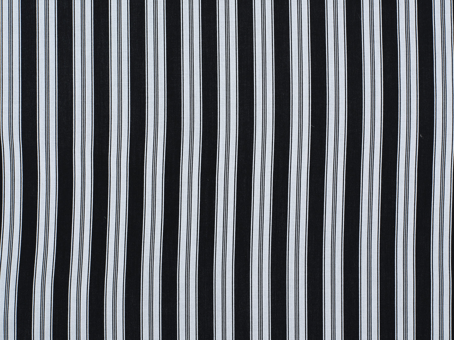 Striped performance fabric in white on black.