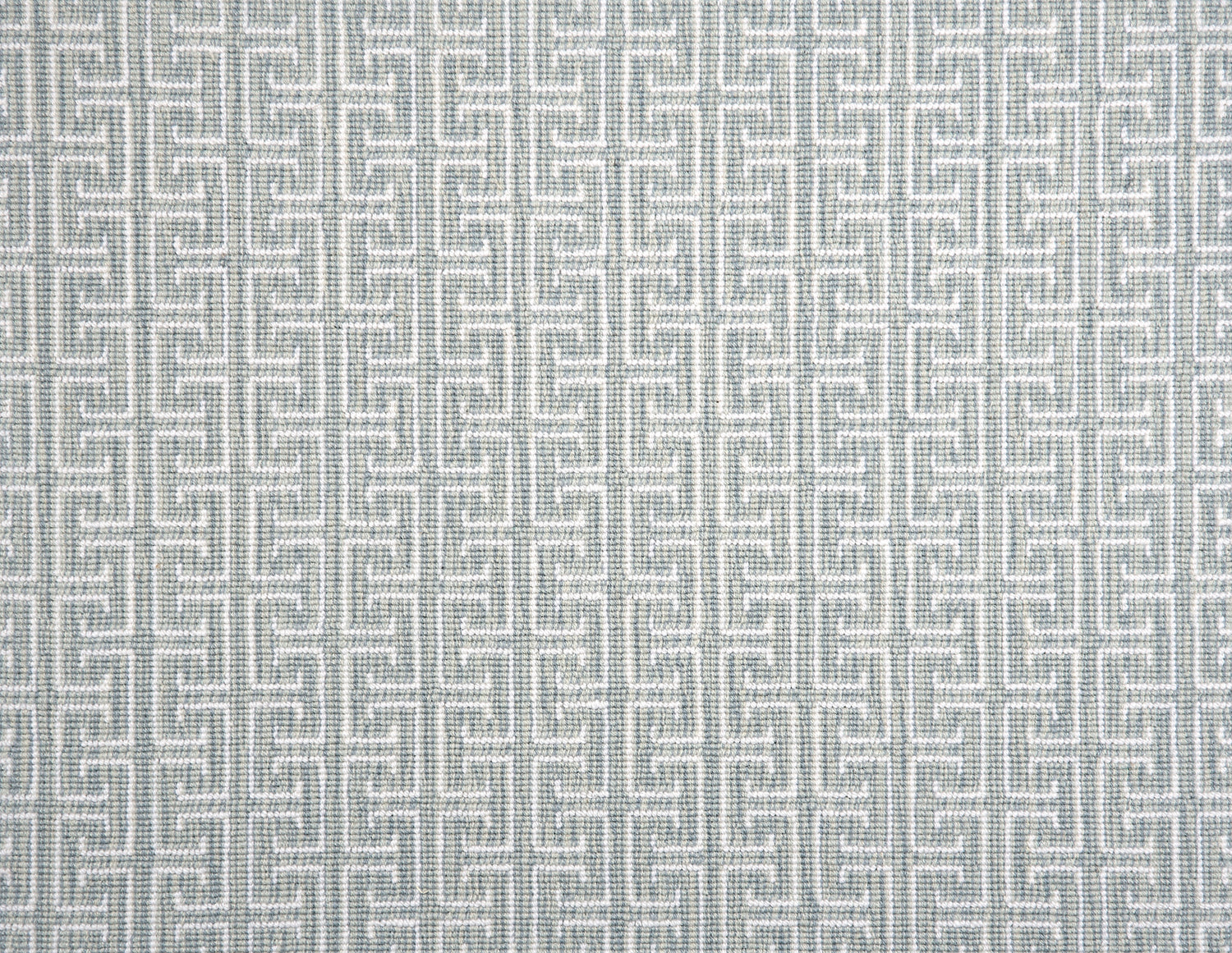 Broadloom carpet with geometric Greek pattern in ivory on  aqua blue.