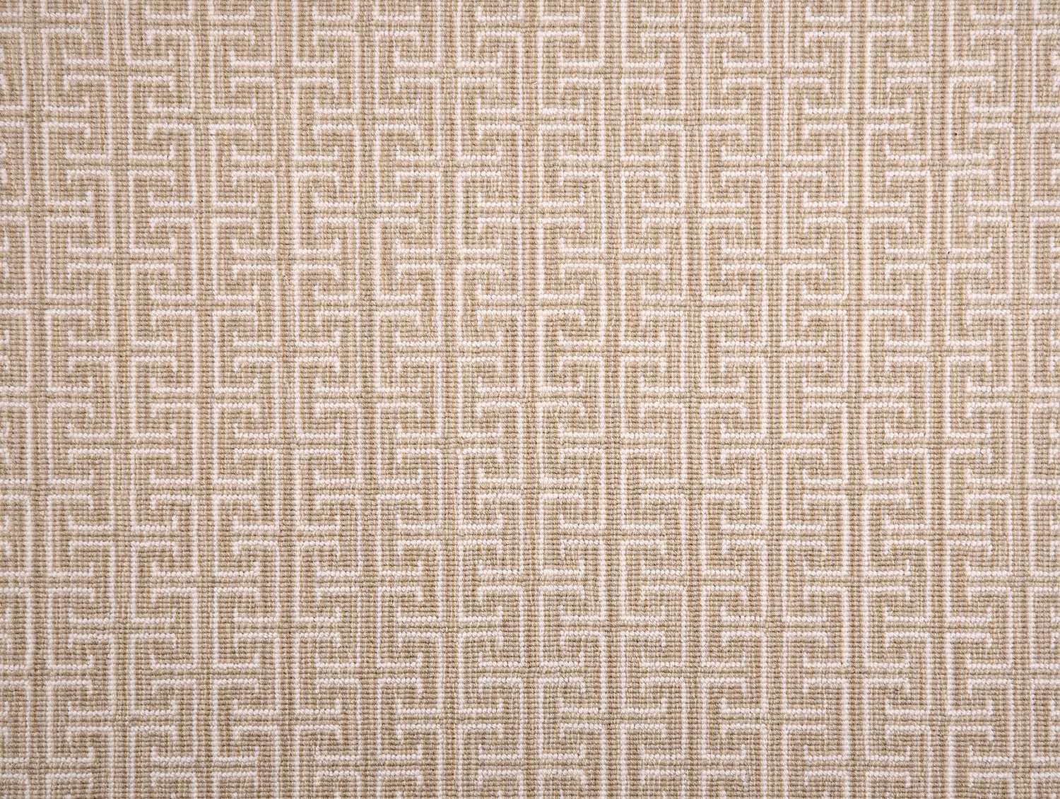 Broadloom carpet with geometric Greek pattern in ivory on tan.