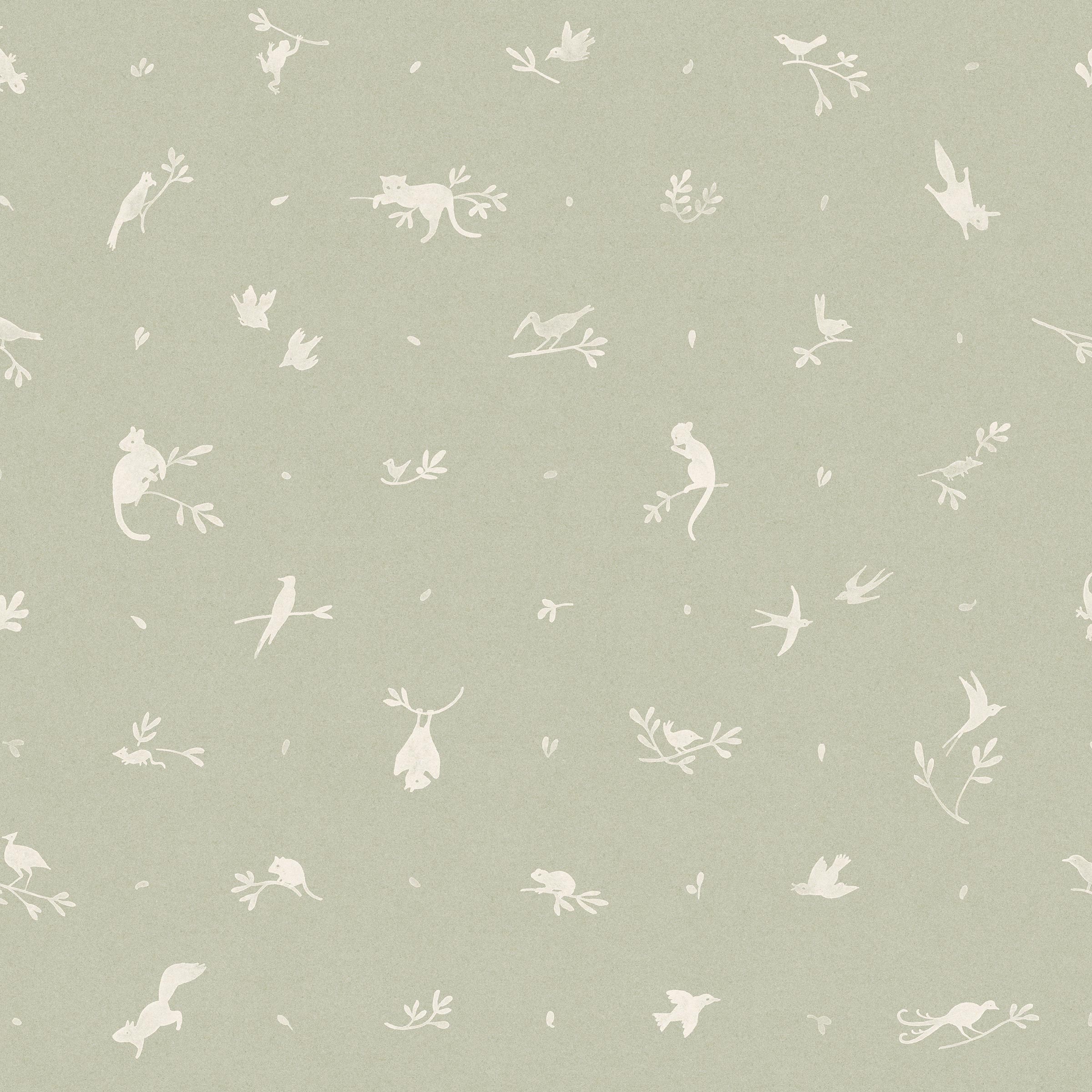 Detail of wallpaper in a playful animal and branch print in white on a sage field.