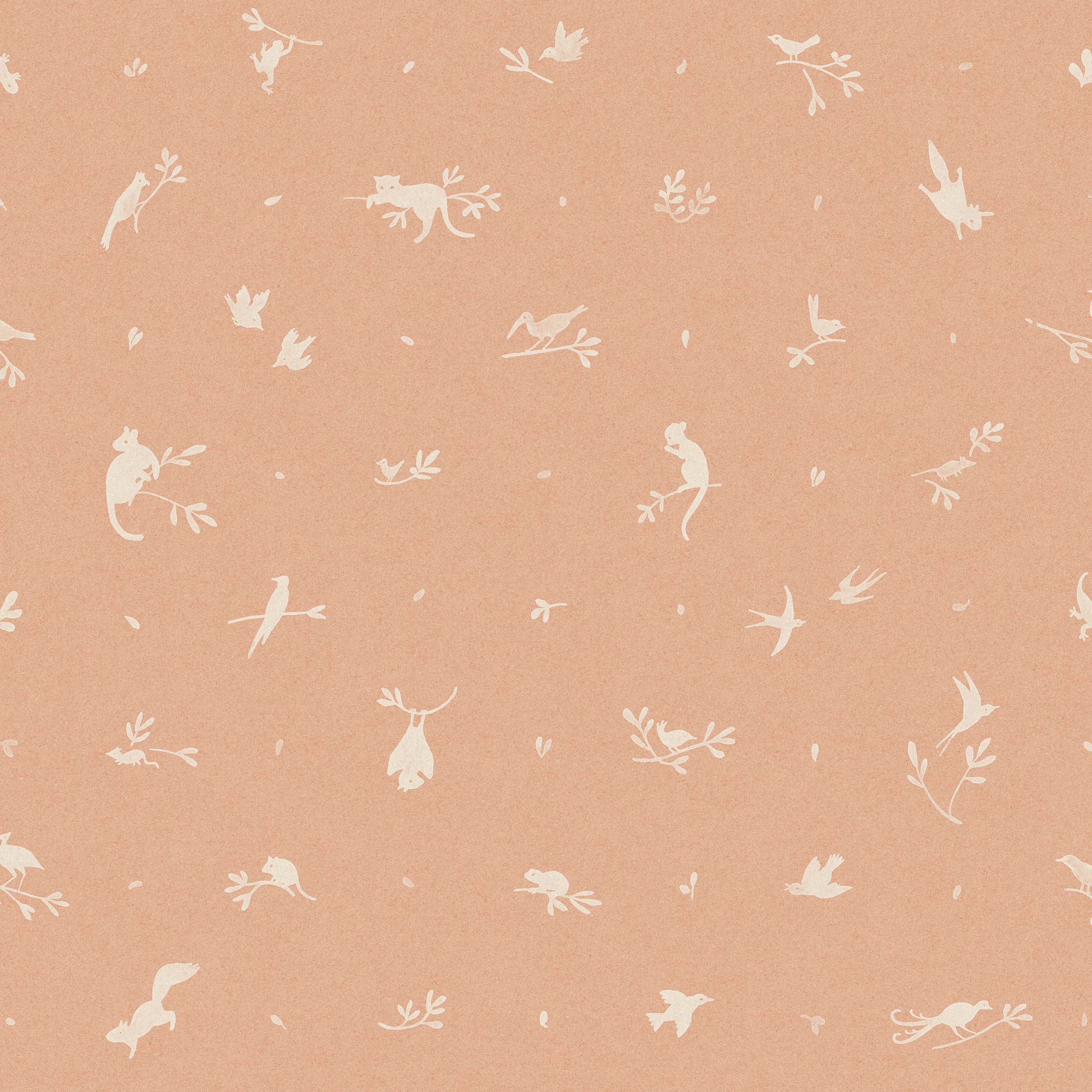 Detail of wallpaper in a playful animal and branch print in white on a coral field.