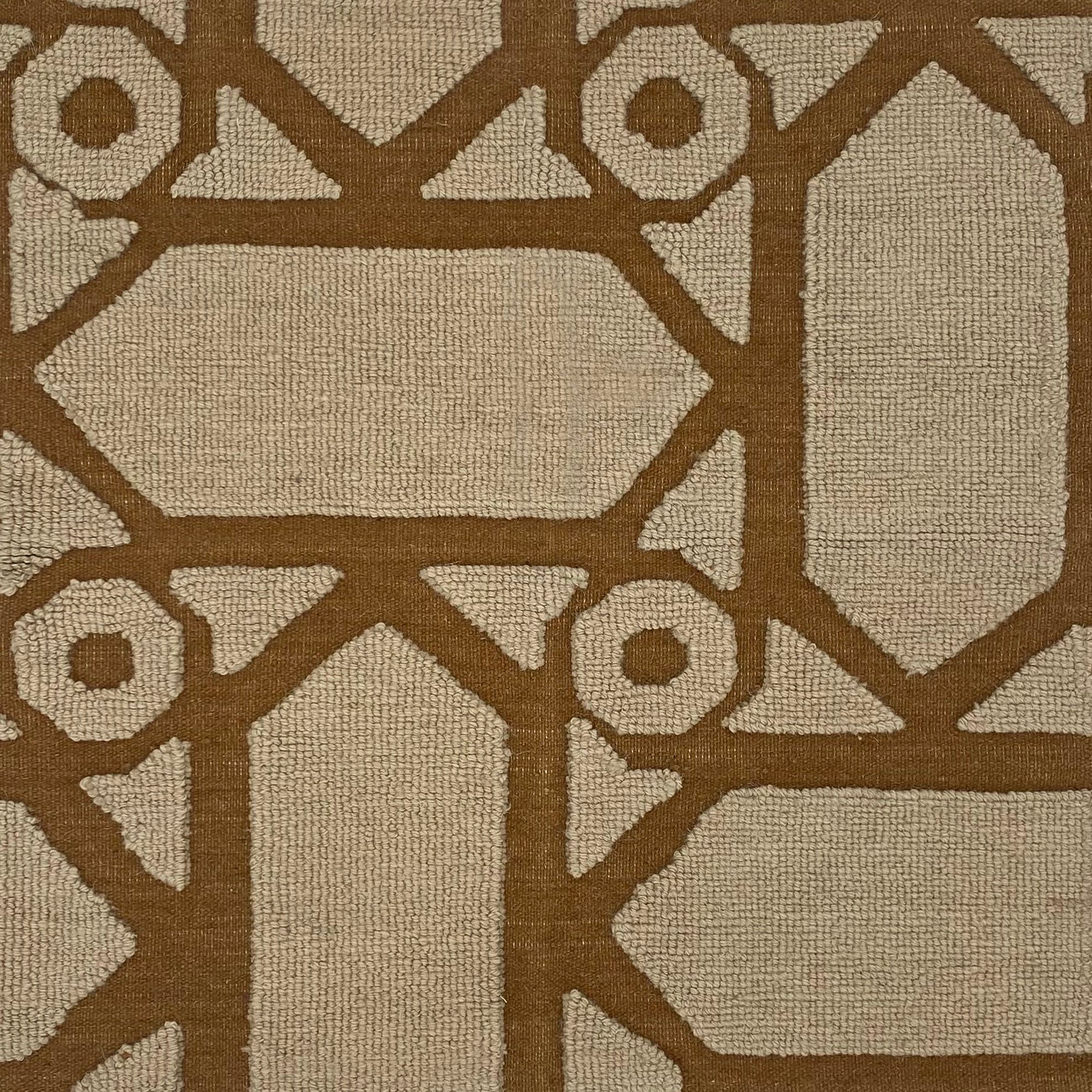 Close-up of a brown geometric pattern on a beige background