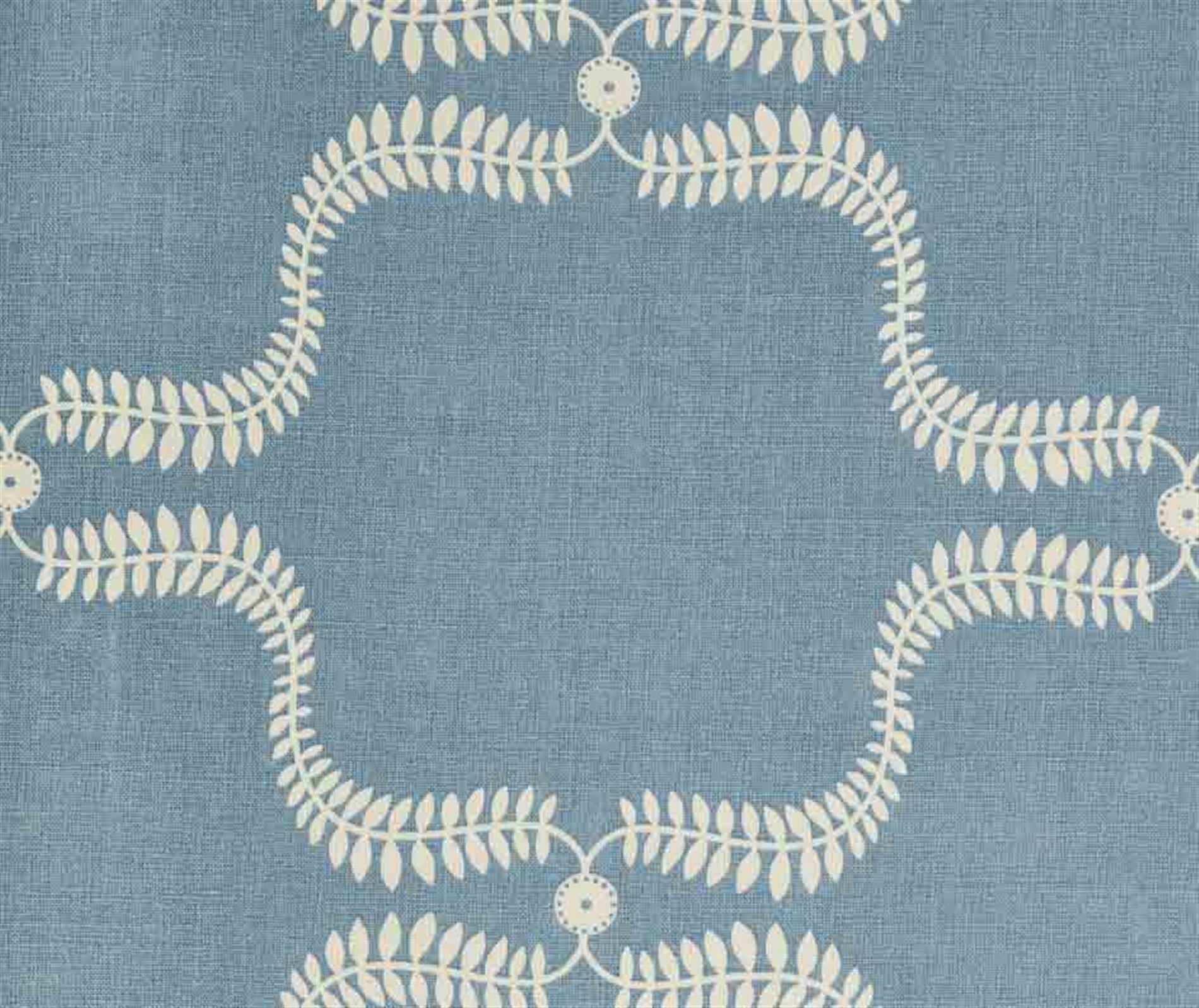 Detail of fabric in a leafy lattice print in cream on a blue field.