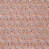 Patterned fabric with small floral design on a brown background