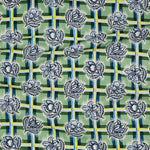 Draped fabric in a linear floral print in shades of cream and light blue on a green field.