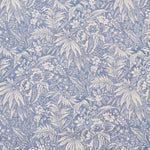 Floral and leaf pattern in blue and white on a blue background