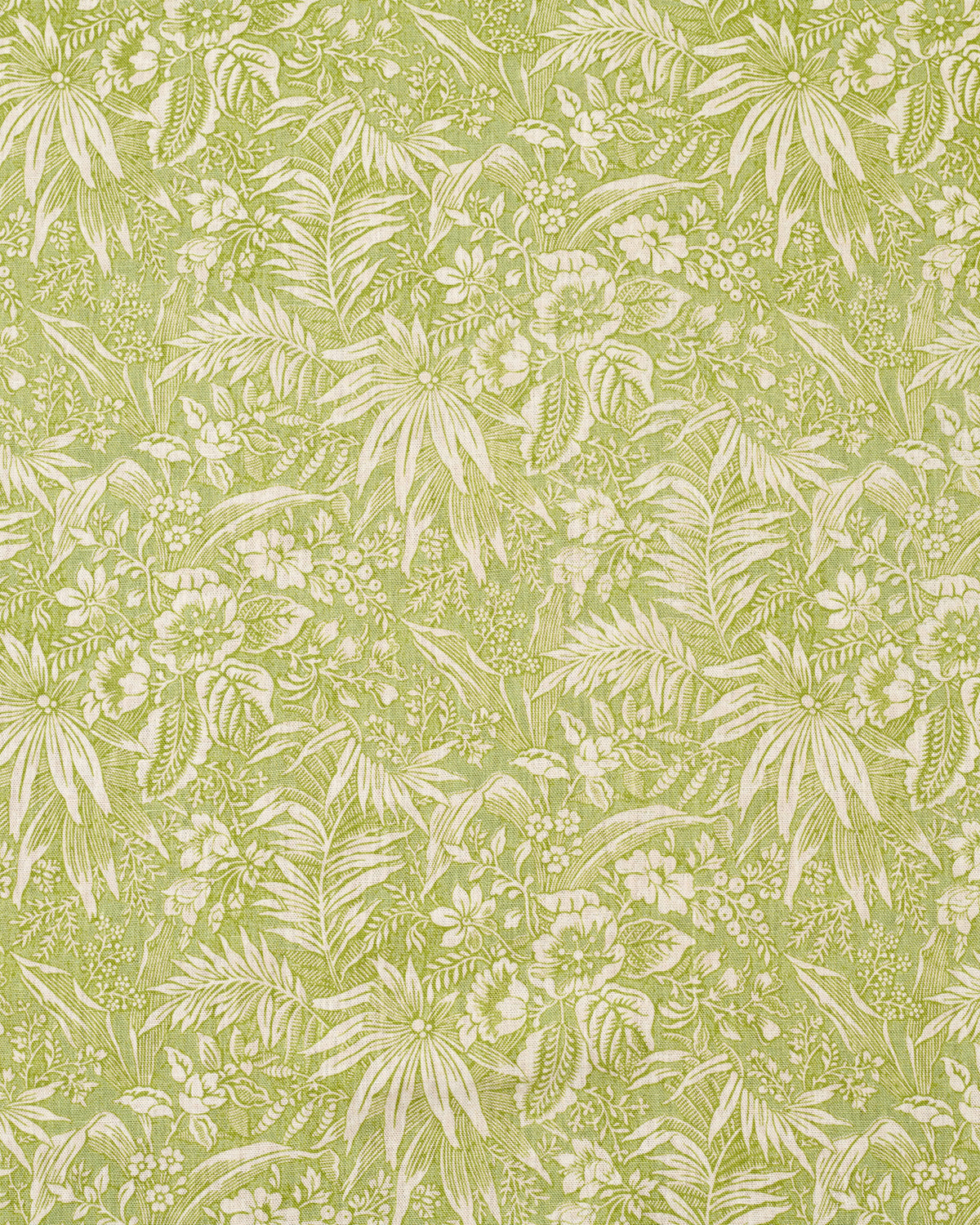 Patterned fabric with green leaves and flowers on a light green background