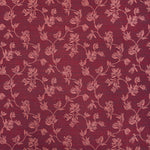 Performance fabric with a scrolling floral design in magenta pink 