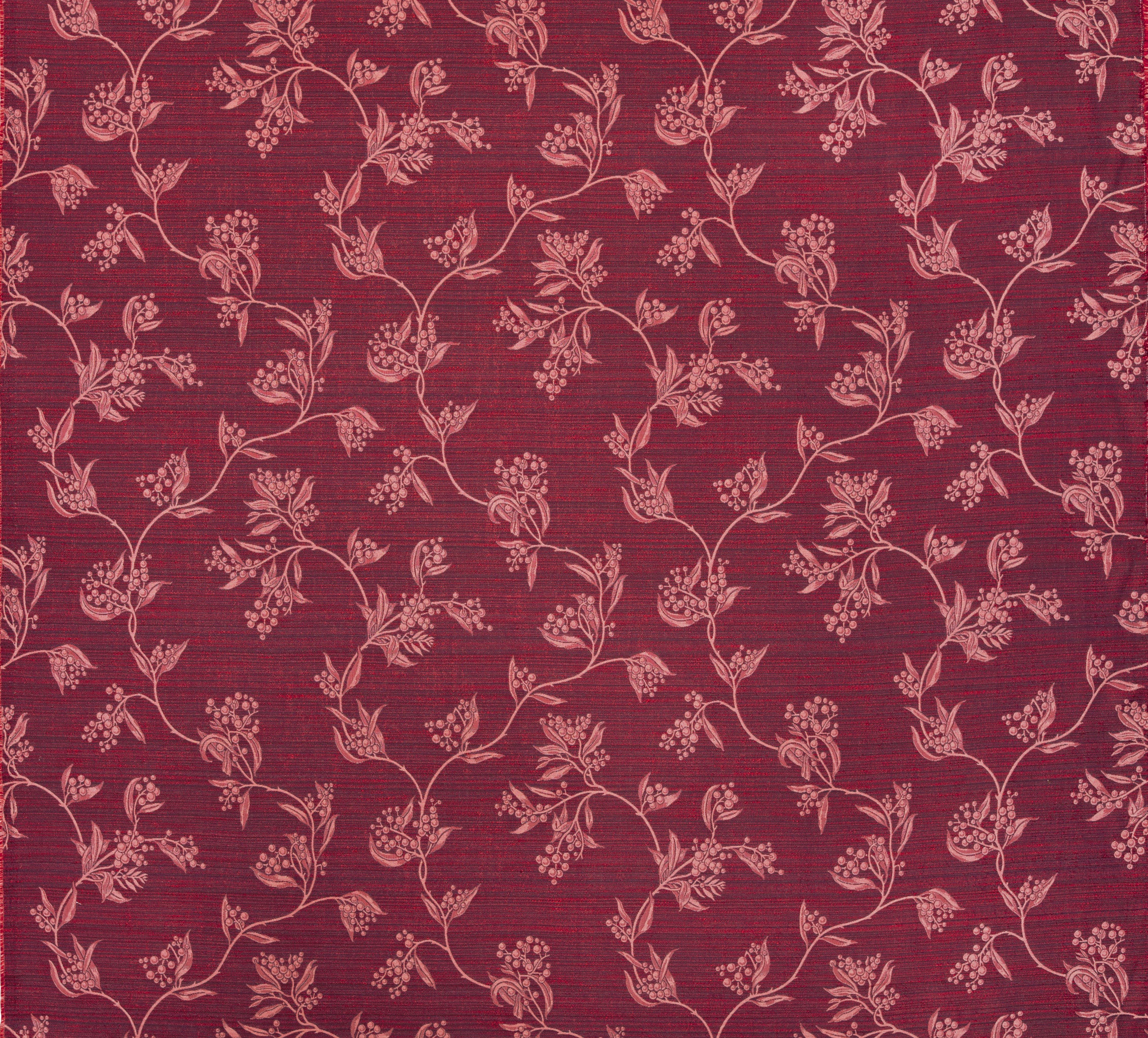 Performance fabric with a scrolling floral design in magenta pink 