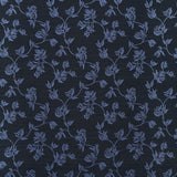 Performance fabric with a scrolling floral design in navy blue. 