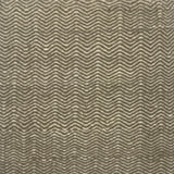 Handwoven rug in a grey and cream chevron pattern.