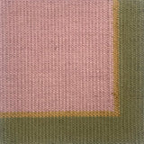 Close up of a flatweave rug in light purple with tan and green border. 