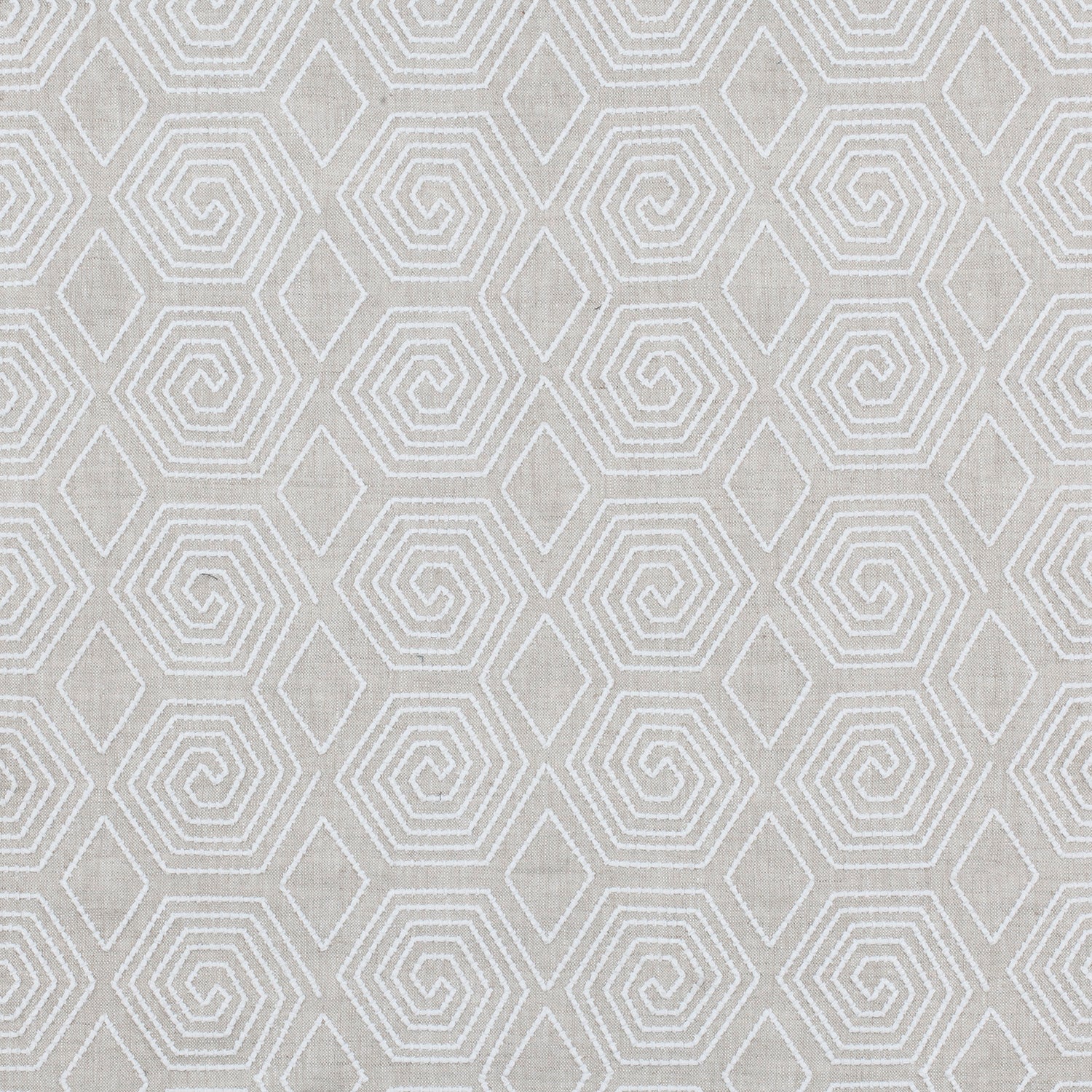 Fabric with a playful embroidered geometric grid print in white on a cream field.