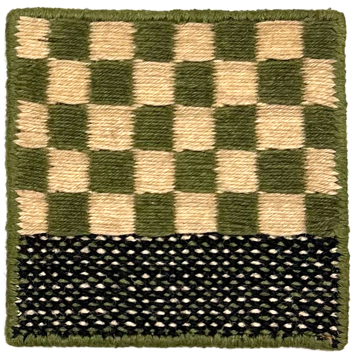 Flatweave rug sample in a green and cream checkerboard with striped border.