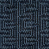 Patterned carpet with a zigzag design in black and blue.