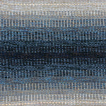Handwoven rug detail in a dimensional design in blue and grey