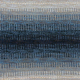 Handwoven rug detail in a dimensional design in blue and grey