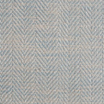 Close up of a rug in a woven herringbone pattern in light blue.
