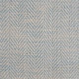 Close up of a rug in a woven herringbone pattern in light blue.