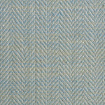Close up of a rug in a woven herringbone pattern in aqua blue.