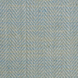 Close up of a rug in a woven herringbone pattern in aqua blue.