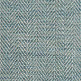 Close up of a rug in a woven herringbone pattern in turquouise.