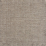 Close up of a rug in a woven herringbone pattern in taupe.