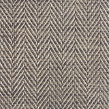 Close up of a rug in a woven herringbone pattern in grey and brown.