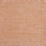 Close up of a rug in a woven herringbone pattern in orange.