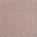 Close up of a rug in a woven herringbone pattern in light pink