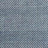 Close up of a rug in a woven herringbone pattern in blue.