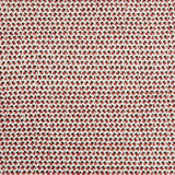 A handwoven rug with a herringbone weave in white with striated yarns of brown and red.
