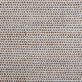 A handwoven rug with a herringbone weave in white with striated yarns of blue cream and brown.