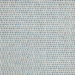 A handwoven rug with a herringbone weave in white with striated yarns of turquoise and blue.