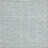 A handwoven rug with a herringbone weave in white with striated yarns of turquoise and blue.